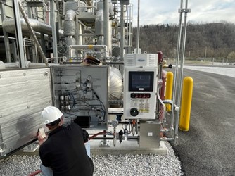 service technician commissioning an analyzer assembly for smooth energy transition